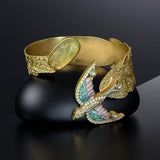Antique gold carved open bracelet with bird design