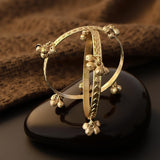 Carved bangle with gungroo accents