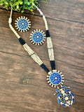 Long pendant set on seed pearls with matching studs