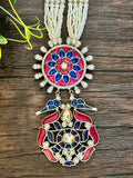 Long pendant set on seed pearls with matching studs