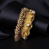 Thick bracelet with silver foil accents and pearls border