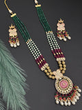 Beads necklace with silver foil pendant and carved stone
