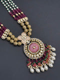 Beads necklace with silver foil pendant and carved stone
