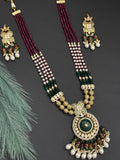 Beads necklace with silver foil pendant and carved stone