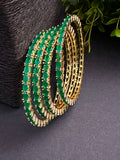 Set of 4 CZ bangles with green stones