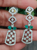 Rhodium finished set with green stones