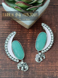Copper finish earrings with carved stone