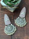 Copper earrings with carved stones and silverfoil kundan