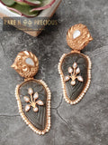 Modern twist on copper earrings with carved stone and inlay work