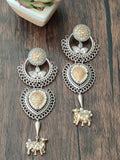 Dual tone german silver earring with nandi