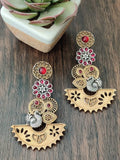 Dual tone long earrings with chandbali design and peacock motifs